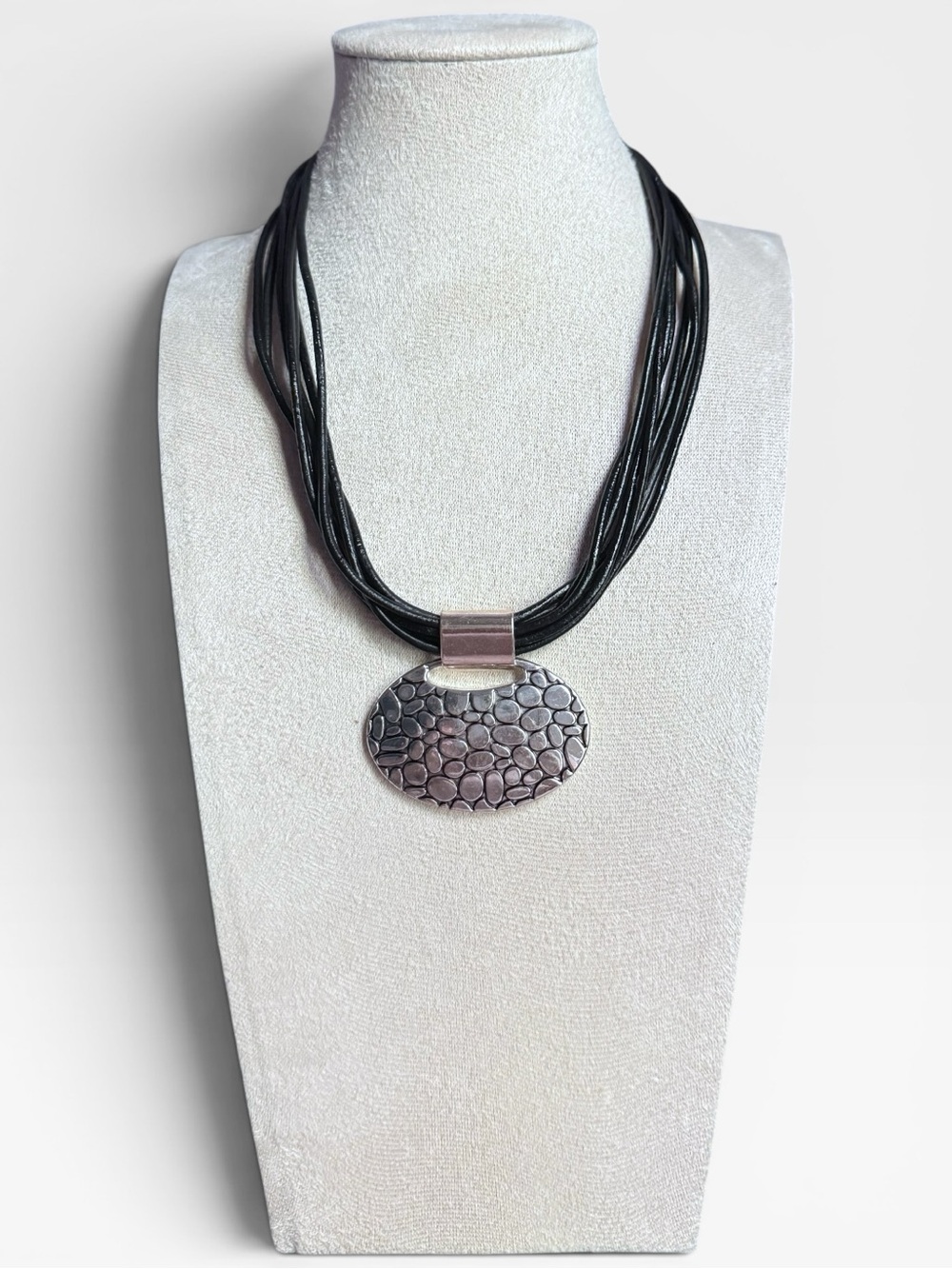 Napier Silver Textured Oval Pendant on Black Multi-Strand Cord